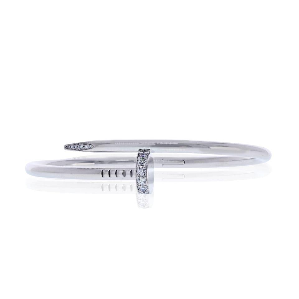 Cartier Juste Un Clou 18K White Gold Diamond Bracelet Size 18: Cartier Juste Un Clou 18K White Gold Diamond Bracelet Size 18 This pre-owned Cartier Juste un Clou bracelet is a stunning piece crafted from 18K white gold, weighing 34.2 grams. The bracelet, sized at