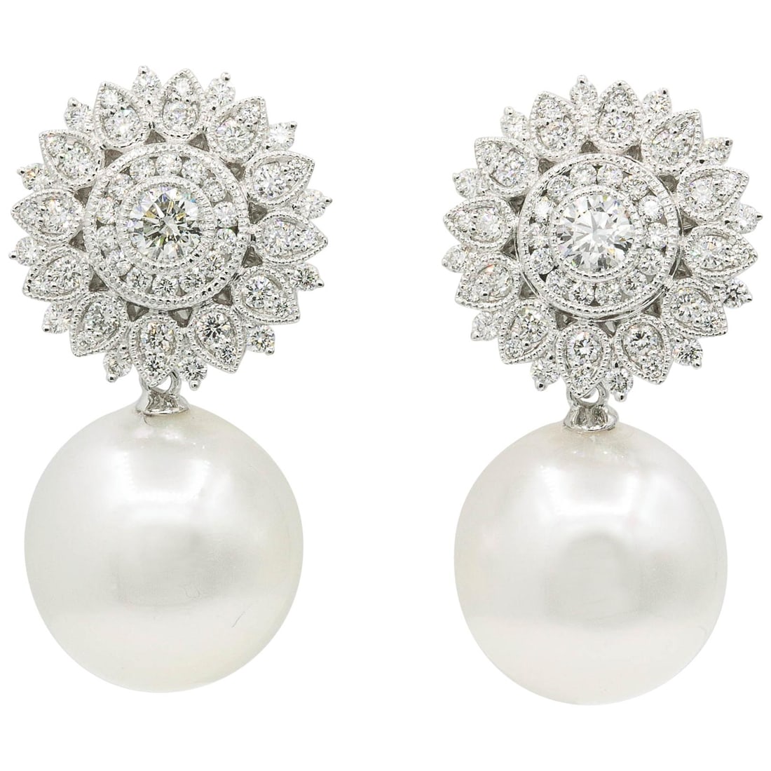 Harbor Diamonds 18K White Gold Diamond Sunflower Pearl Drop Earrings 1.35 Carats: Harbor Diamonds 18K White Gold Diamond Sunflower Pearl Drop Earrings 1.35 Carats These stunning earrings feature a contemporary design with a beautiful diamond sunflower motif, set in 18K white gold.