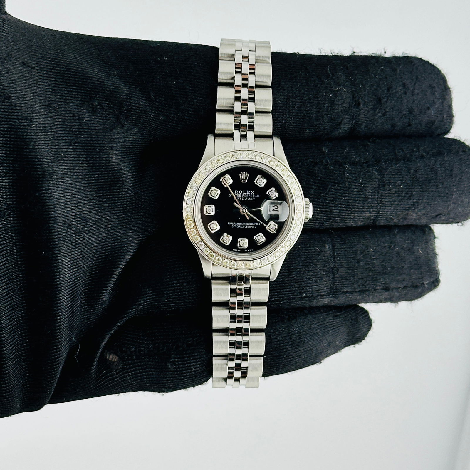 Ladies Datejust Ref 69190 Aftermarket Black Diamond Dial Jubilee Bracelet: Ladies Datejust Ref 69190 Aftermarket Black Diamond Dial Jubilee Bracelet This ladies' Rolex Datejust features an aftermarket black diamond dial, a pave diamond bezel, and is paired with a Jubilee bra