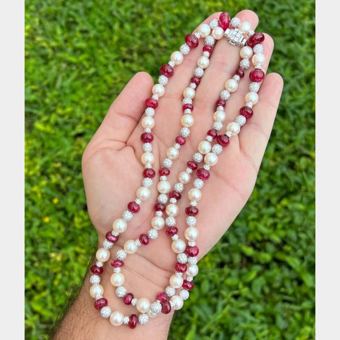 Stunning Platinum Necklace with 37 Rubies 60 Ct Diamonds and Pearls: Stunning Platinum Necklace with 37 Rubies 60 Ct Diamonds and Pearls This exquisite Platinum Necklace features a stunning combination of Rubies, Diamonds, and Pearls. The necklace is set with 37 vibran