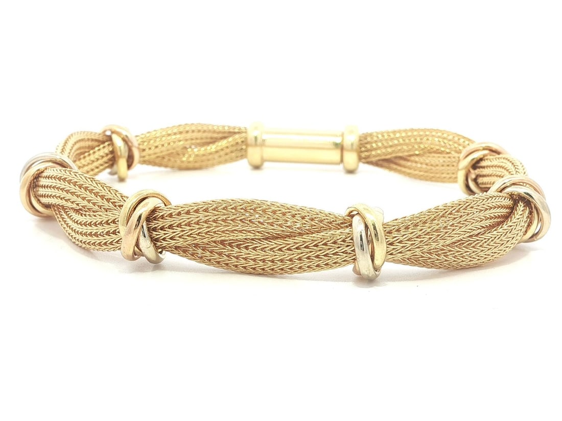 Italian 18k Yellow Gold Braided Mesh Bracelet with Tri Color Rolling Rings: Italian 18k Yellow Gold Braided Mesh Bracelet with Tri Color Rolling Rings This vintage Italian bracelet is crafted from solid 18k yellow gold and features an elegant braided mesh link design with sec