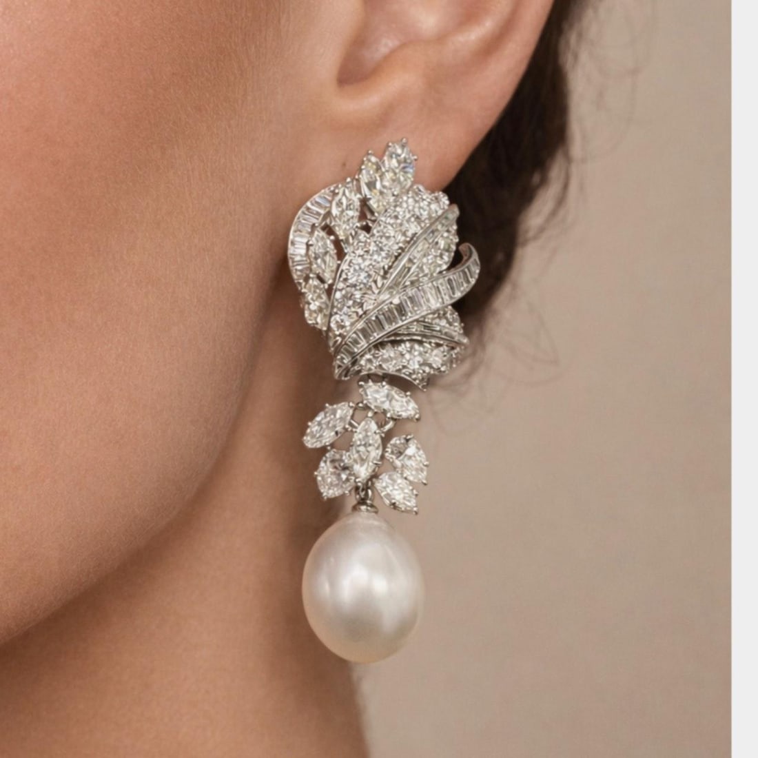 Platinum Earrings with 10.90 Ct Diamonds and South Sea Pearls by David Webb: Platinum Earrings with 10.90 Ct Diamonds and South Sea Pearls by David Webb These platinum earrings by David Webb feature 2 South Sea pearls measuring between 14.0 and 11.4 mm. The earrings are adorne