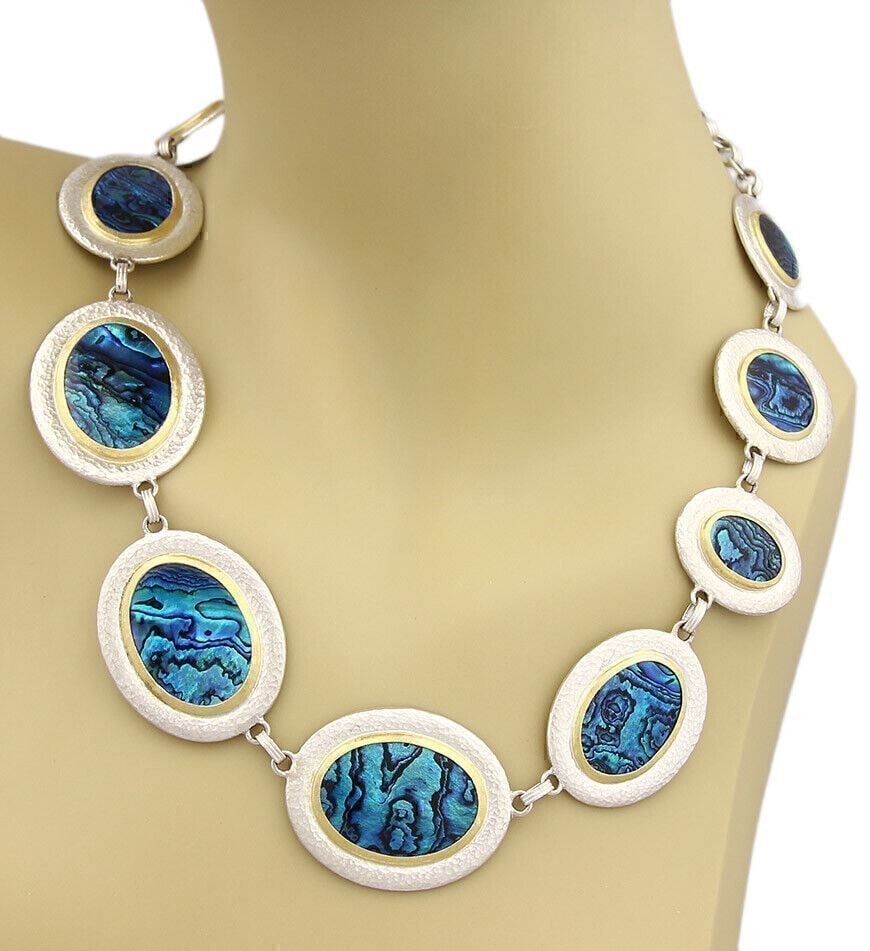 Paua Shell Necklace with Sterling Silver and 24k Gold Discs by Gurhan: Paua Shell Necklace with Sterling Silver and 24k Gold Discs by Gurhan This Gurhan Surf necklace features a striking blue paua shell as the centerpiece, set in sterling silver with 24k gold accent disc