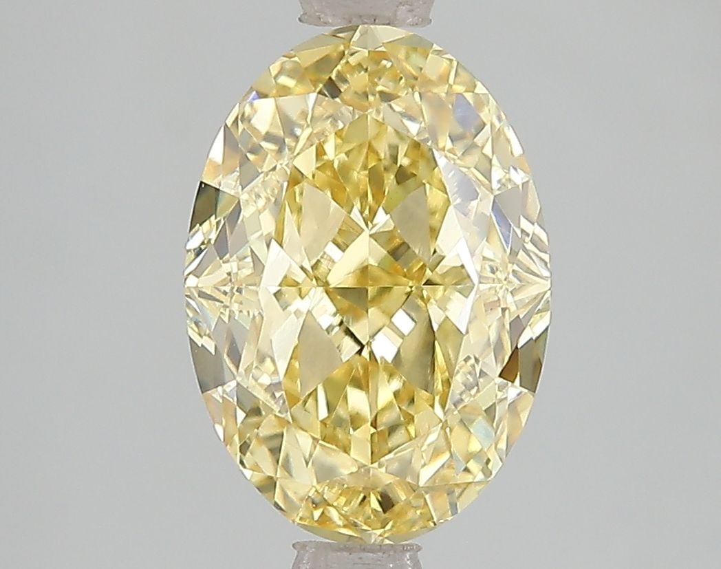 Loose Diamond - OVAL 3.03ct Fancy Vivid Yellow VVS2: Loose Diamond - OVAL 3.03ct Fancy Vivid Yellow VVS2 Source: This is a real non-mined Diamond that has been grown in a lab Shape: OVAL Carats: 3.03 Color: Fancy Vivid Yellow Certification: IGI Video: