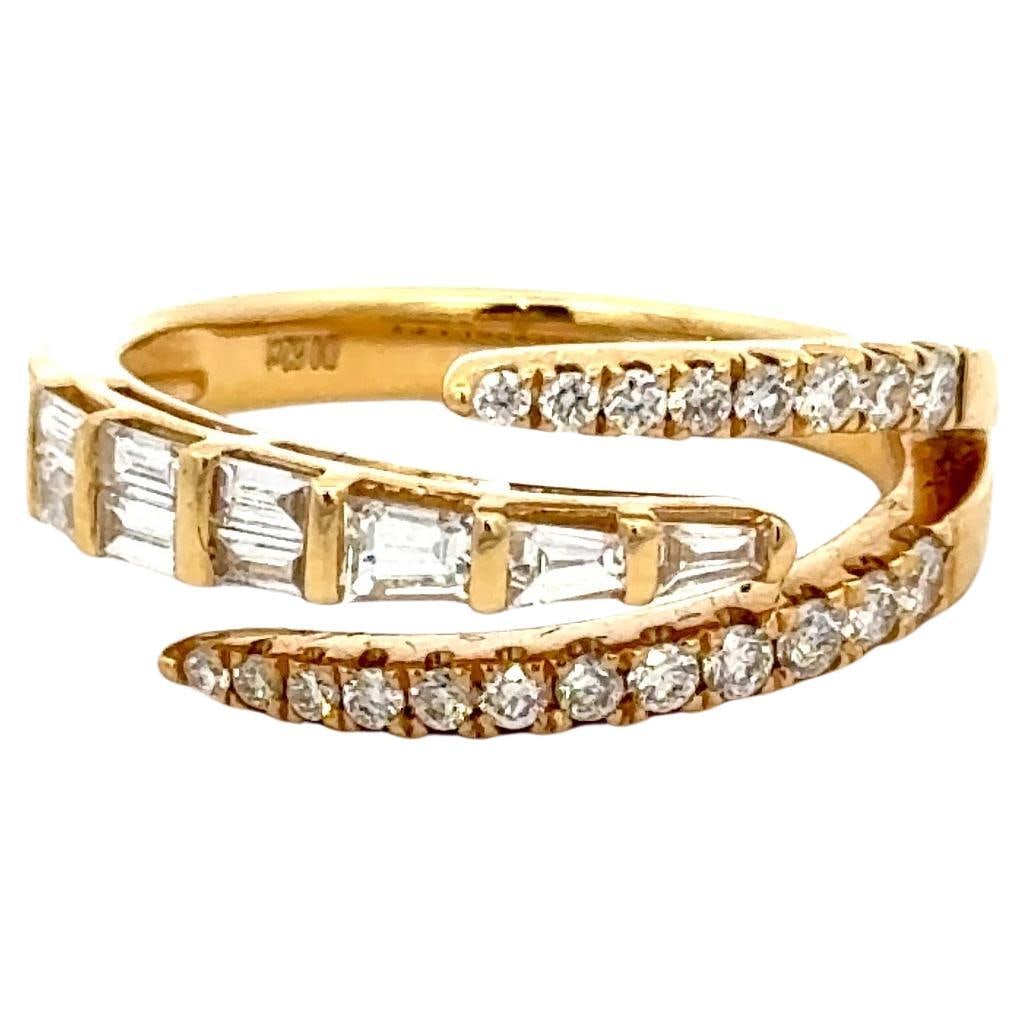 18K Yellow Gold Crossover Ring with 0.62 Carats Round and Baguette Diamonds: 18K Yellow Gold Crossover Ring with 0.62 Carats Round and Baguette Diamonds This exquisite Three Row Claw Crossover Baguette Round Diamond Ring is crafted from 14K yellow gold, showcasing a stunning i
