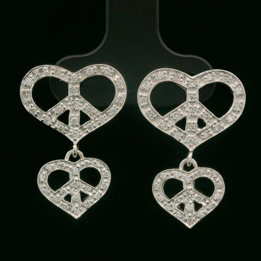 White Gold 0.30ct Diamond Double Heart Dangle Earrings: White Gold 0.30ct Diamond Double Heart Dangle Earrings Embrace elegance with these stunning dangle earrings featuring a double open hearts design. Crafted from 17-18K solid white gold, these earrings