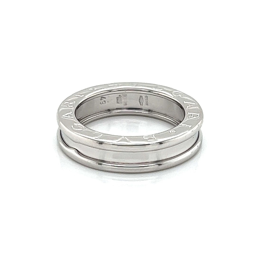 B.zero1 18k White Gold Band Ring by Bvlgari Size 5: B.zero1 18k White Gold Band Ring by Bvlgari Size 5 This authentic Bvlgari B.Zero1 One Band Ring is crafted in solid 18k white gold and features a sleek, high-polished finish. The design showcases the