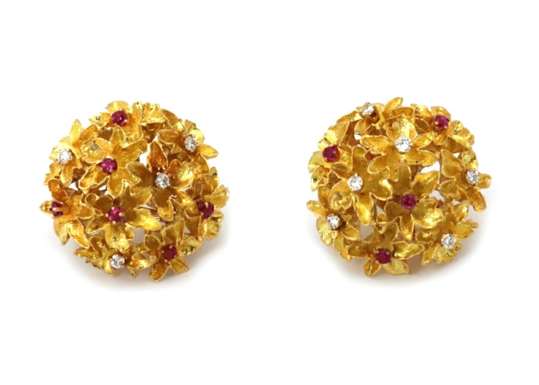 Vintage Ruby Diamond 18k Gold Floral Cluster Earrings with 14k Omega Backs: Vintage Ruby Diamond 18k Gold Floral Cluster Earrings with 14k Omega Backs These vintage stud earrings feature a 3D cluster flower design set with rubies and diamonds. Crafted in 18k yellow gold with