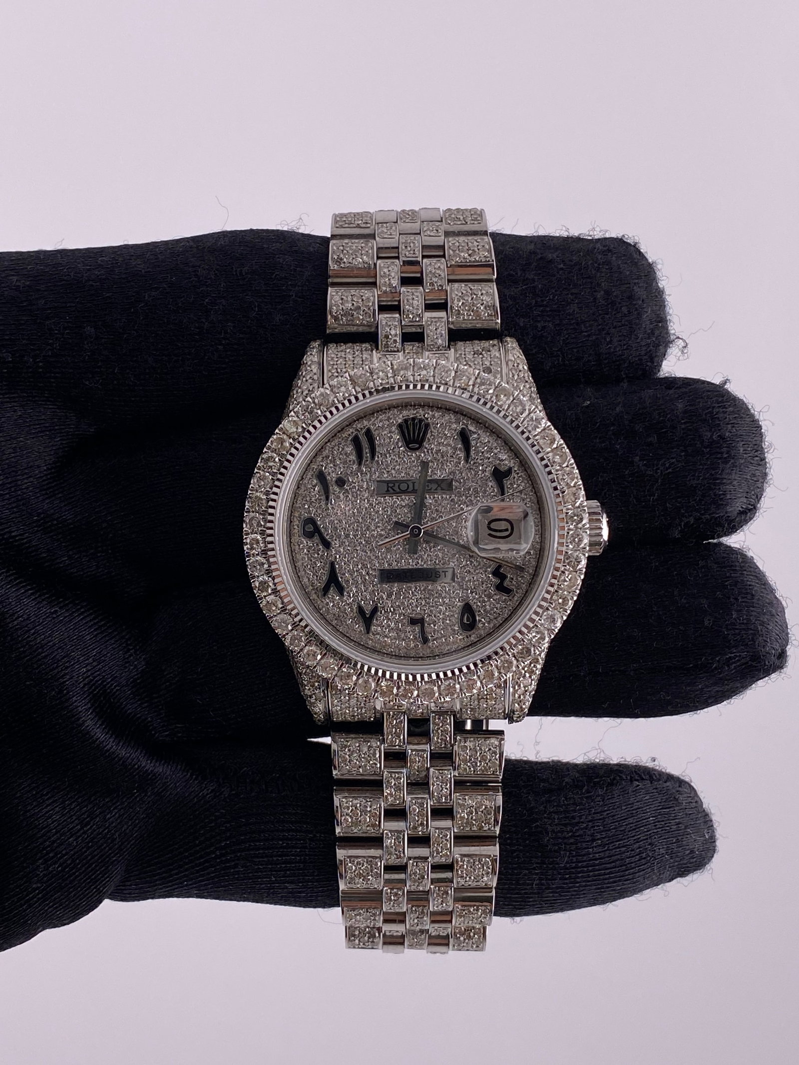 Rolex 1603 Datejust Mens Watch Diamond Arabic Dial Jubilee Bracelet: Rolex 1603 Datejust Mens Watch Diamond Arabic Dial Jubilee Bracelet This men's Rolex Datejust features a Diamond Arabic dial and a diamond bezel, paired with a Jubilee bracelet. The watch is identifie