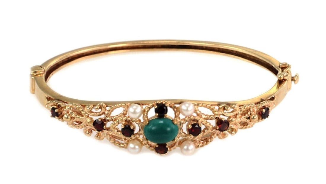 Vintage 14k Yellow Gold Bangle Bracelet with Pearls Turquoise and Garnets: Vintage 14k Yellow Gold Bangle Bracelet with Pearls Turquoise and Garnets This vintage bangle bracelet features an elegant design crafted in 14k yellow gold and is adorned with pearls, turquoise, and