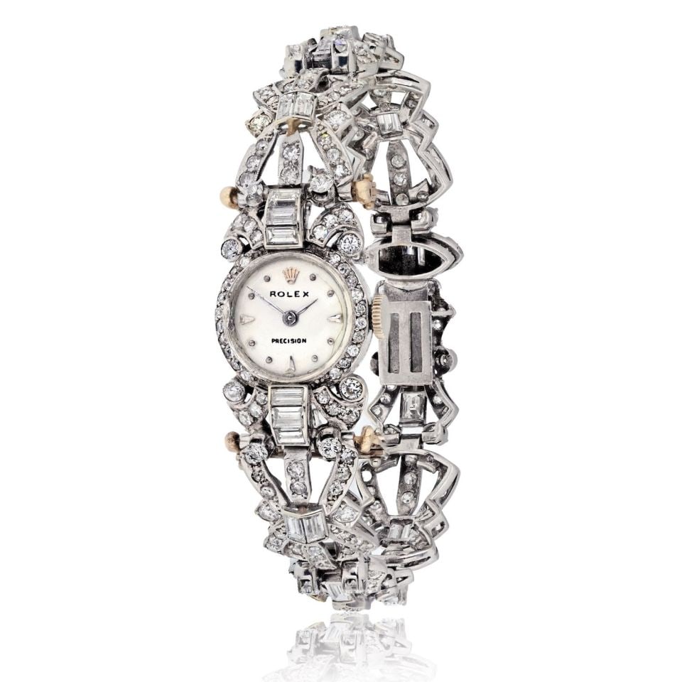 Rolex Vintage 18K White Gold Diamond Watch 5.5 Cts: Rolex Vintage 18K White Gold Diamond Watch 5.5 Cts This exquisite vintage Rolex watch showcases the timeless elegance of 18K white gold, weighing 24.4 grams. Adorned with stunning diamonds, it feature