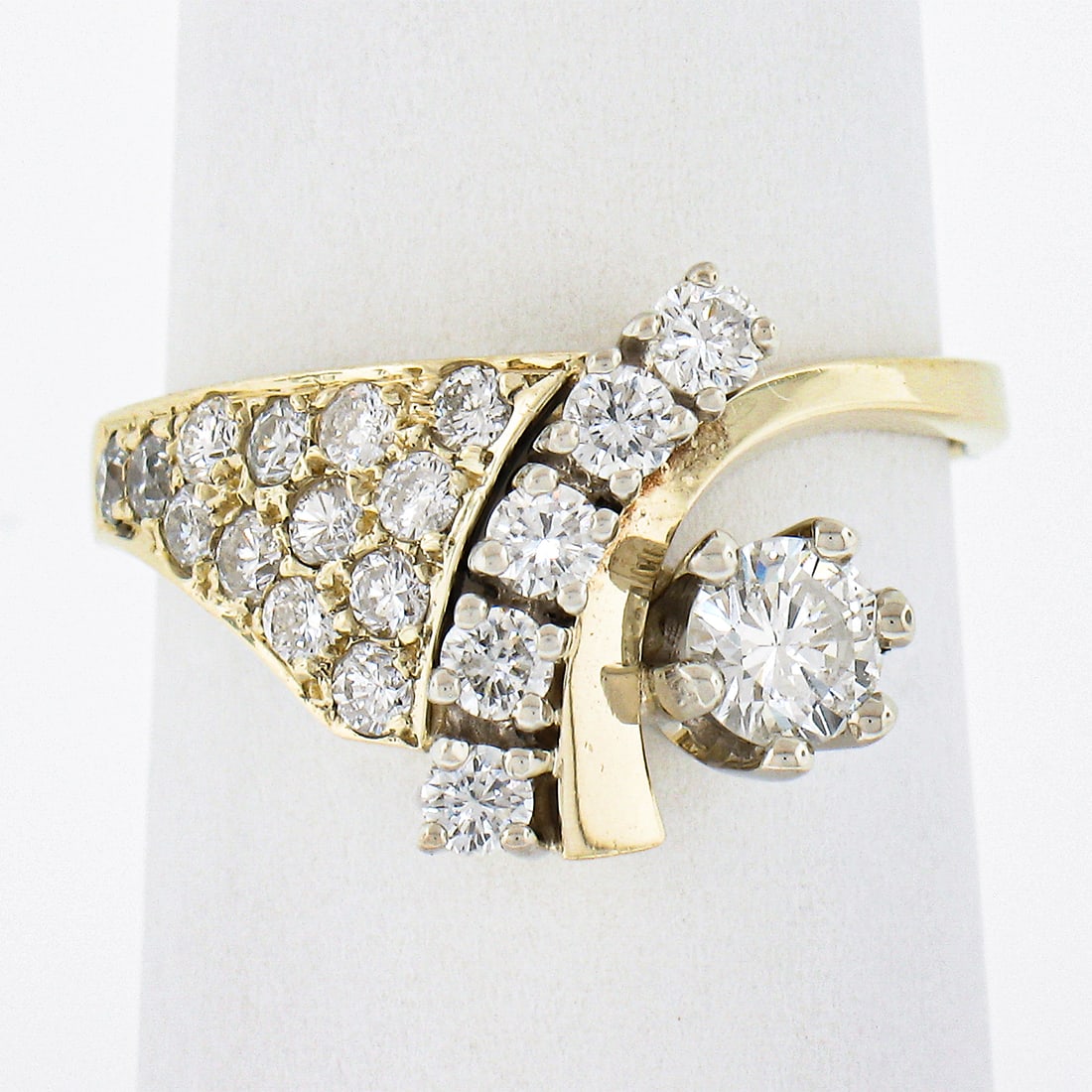 Vintage 14k Yellow Gold 0.90ct Diamond Cocktail Ring Statement: Vintage 14k Yellow Gold 0.90ct Diamond Cocktail Ring Statement This stunning vintage cocktail ring features a rich 14k yellow gold setting adorned with a total of 19 natural diamonds, creating an eye-