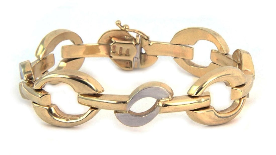 14k Yellow and White Gold Wide Link Bracelet Two Tone Design: 14k Yellow and White Gold Wide Link Bracelet Two Tone Design This wide fancy link bracelet is crafted from 14k two-tone gold, featuring both yellow and white gold elements. The bracelet has a substant