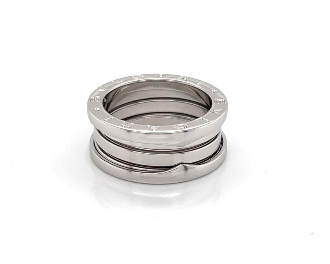 B.zero1 Triple Band 18k White Gold Ring with Certificate Size 6: B.zero1 Triple Band 18k White Gold Ring with Certificate Size 6 The Bvlgari B.zero1 Three-Band Ring is crafted in 18k white gold with a high-polished finish. This authentic piece from the iconic B.zer