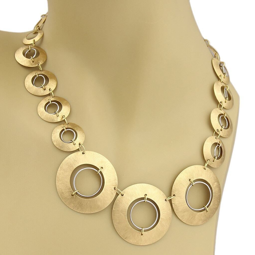 Graduated Circle Link Necklace in 18k Yellow and White Gold by Citra: Graduated Circle Link Necklace in 18k Yellow and White Gold by Citra This Citra necklace features a refined graduated circle link design crafted in 18k two-tone gold, combining both yellow and white g