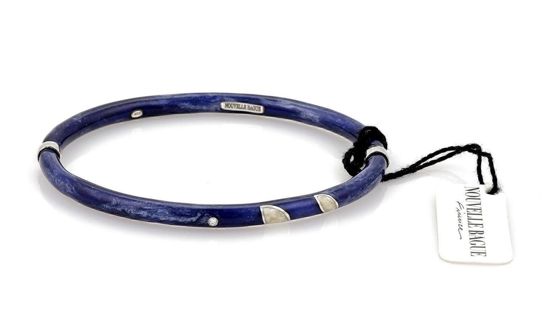 Diamond Blue Enamel 18k Gold Sterling Silver Bangle by Nouvelle Bague: Diamond Blue Enamel 18k Gold Sterling Silver Bangle by Nouvelle Bague This luxurious bangle bracelet by Nouvelle Bague is crafted in Italy from sterling silver and features elegant accents of 18k gold