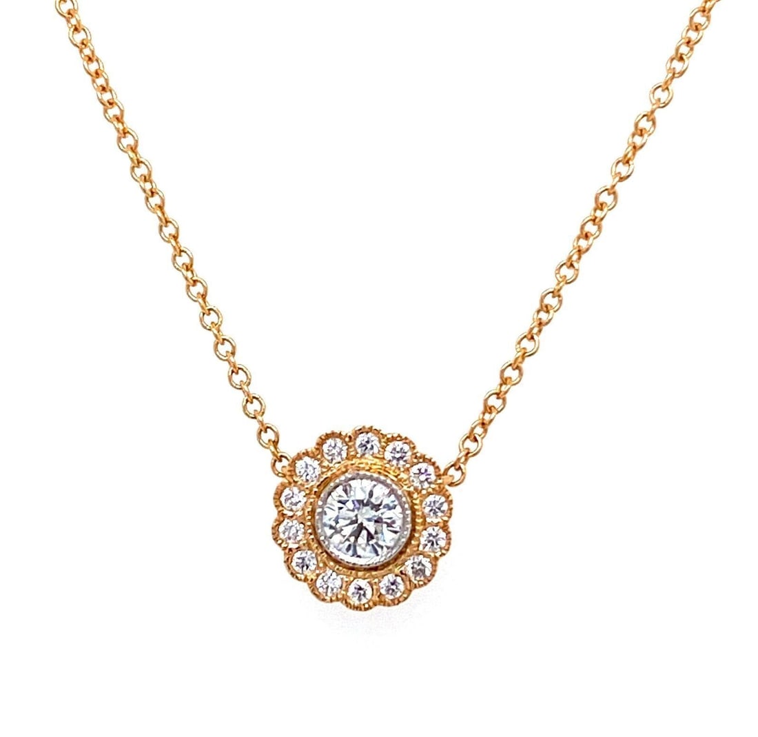 Enchant pendant necklace in 18k rose gold and platinum with diamonds by Tiffany & Co.: Enchant pendant necklace in 18k rose gold and platinum with diamonds by Tiffany & Co. This original Tiffany & Co. Enchant pendant necklace features a delicate design set with natural diamonds totaling