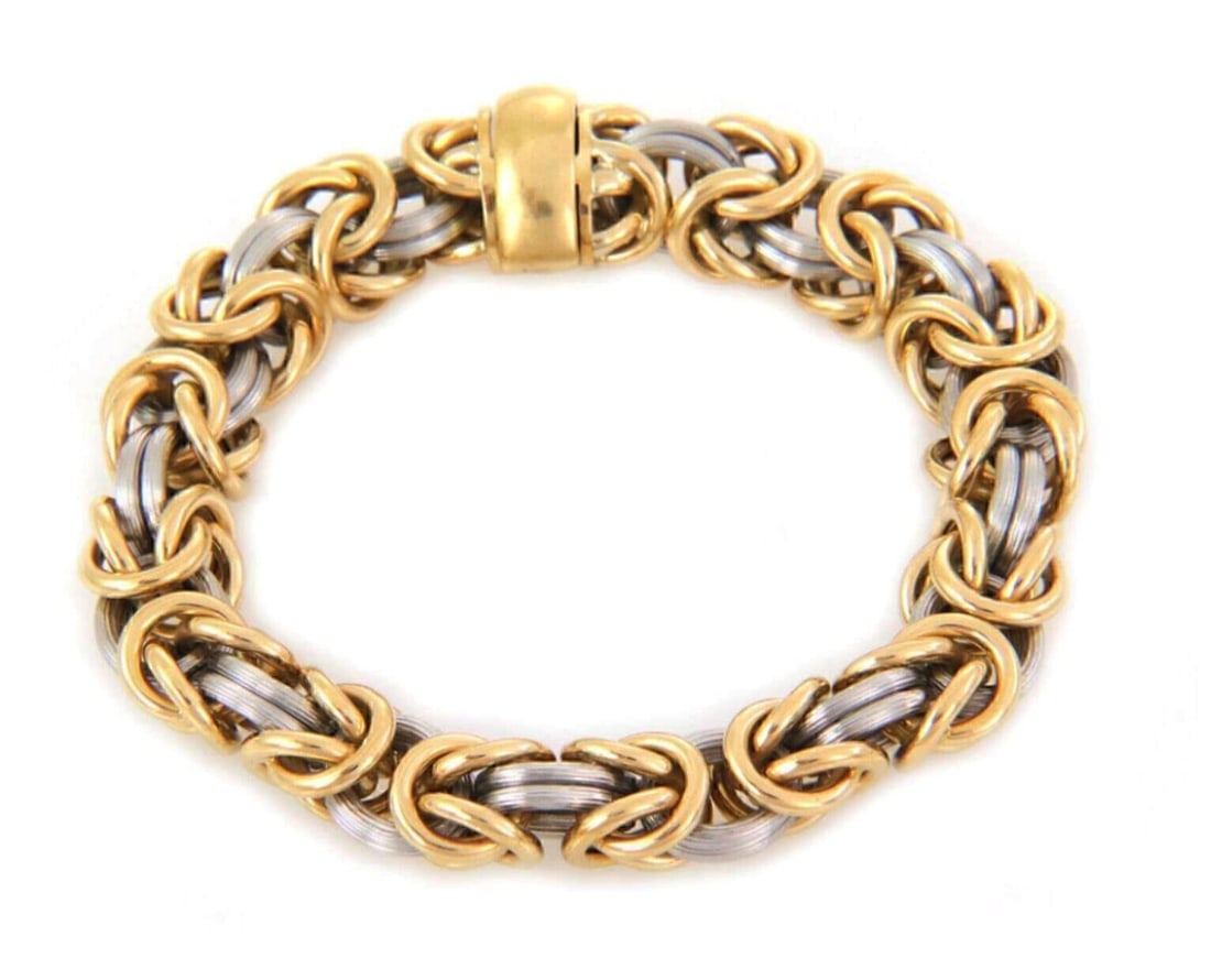 Byzantine Link Bracelet in 18k Gold and Platinum by Rom Germany: Byzantine Link Bracelet in 18k Gold and Platinum by Rom Germany This authentic bracelet features a Byzantine link design crafted from solid 18k yellow gold and platinum. It combines polished yellow go