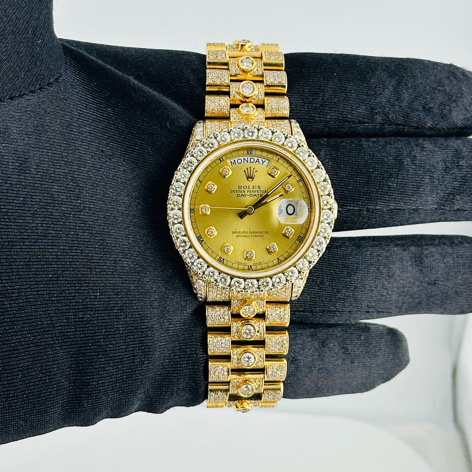 AM Day-Date Ref 18038 Mens Watch with Champagne Diamond Dial and Diamond Bezel: AM Day-Date Ref 18038 Mens Watch with Champagne Diamond Dial and Diamond Bezel This men's Rolex Day-Date features an aftermarket champagne diamond dial and a diamond bezel. The watch is equipped with