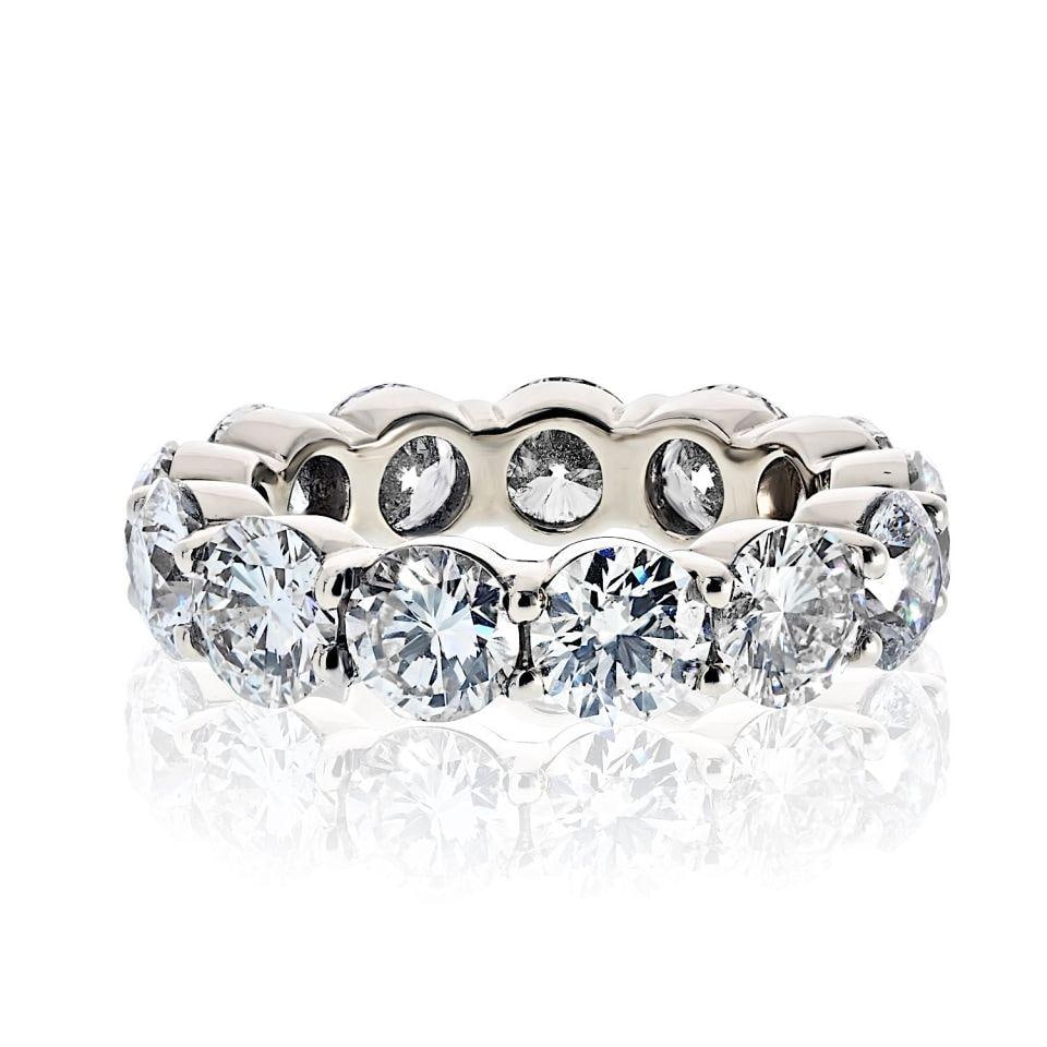 Round Brilliant Diamond Eternity Band with 7.15 Carat Total Weight: Round Brilliant Diamond Eternity Band with 7.15 Carat Total Weight This pre-owned eternity ring features a total diamond weight of 7.15 carats, set with round brilliant cut diamonds. The ring is desig
