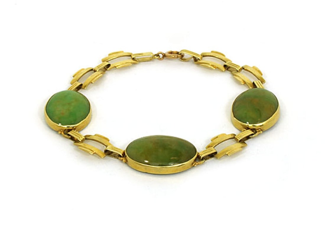 Vintage 14k Yellow Gold Jade Oval and Bar Link Bracelet: Vintage 14k Yellow Gold Jade Oval and Bar Link Bracelet This vintage bracelet features an elegant link design with intricate oval and bar motifs, crafted from 14k yellow gold and set with jade gemston