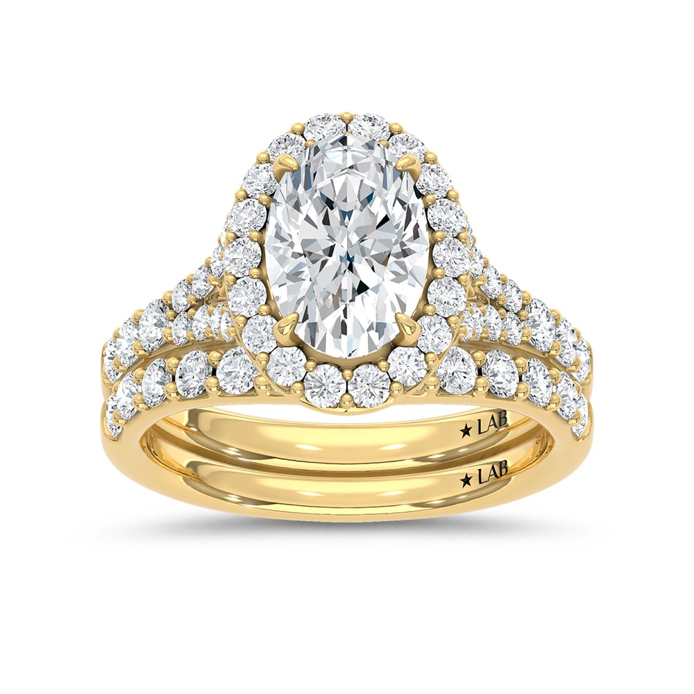 14K Yellow Gold 3 Ct.Tw. Lab Grown Diamond Oval Shape Bridal Ring (IGI Certified Center 2ct Oval): 14K Yellow Gold 3 Ct.Tw. Lab Grown Diamond Oval Shape Bridal Ring (IGI Certified Center 2ct Oval) 14k Yellow Gold Stone Color: D-f Stone Clarity: Vs Each ring is presented in standard size 6.5. Compli