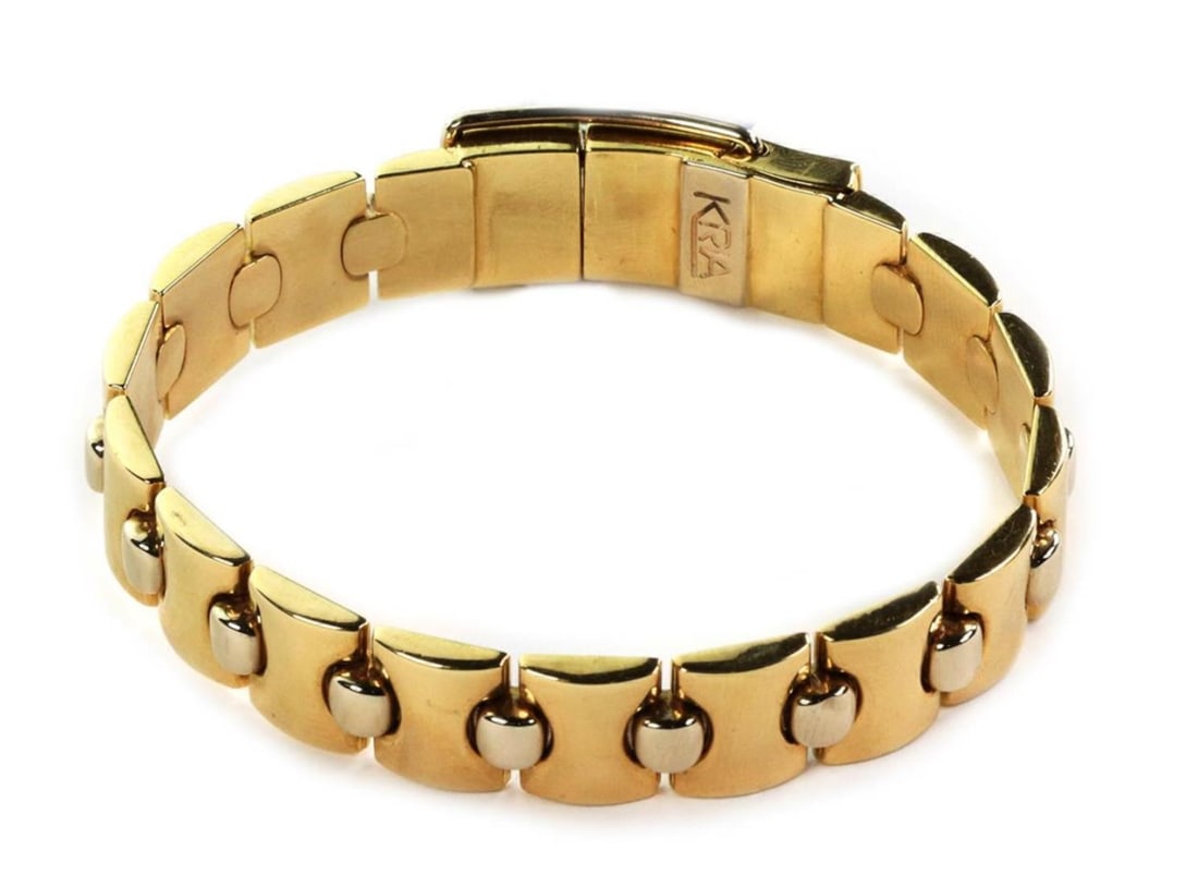 Italian 18k Yellow and White Gold 12mm Link Bracelet by Kria: Italian 18k Yellow and White Gold 12mm Link Bracelet by Kria This elegant flexible link bracelet by Italian designer Kria is crafted from 18k yellow and white gold. It features a 12mm wide design with