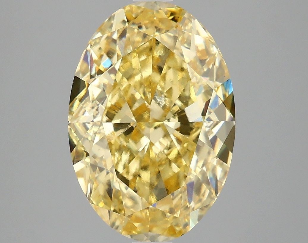Loose Diamond - OVAL 4.06ct Fancy Vivid Yellow VS1: Loose Diamond - OVAL 4.06ct Fancy Vivid Yellow VS1 Source: This is a real non-mined Diamond that has been grown in a lab Shape: OVAL Carats: 4.06 Color: Fancy Vivid Yellow Certification: IGI Video: