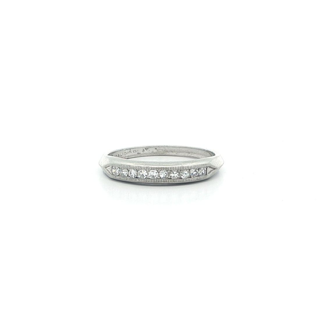 Platinum Diamond Channel Set Band With Old Single Cut Stones 0.10ctw Antique: Platinum Diamond Channel Set Band With Old Single Cut Stones 0.10ctw Antique This antique platinum band ring features ten natural old single cut diamonds set in a classic channel style. The diamonds a