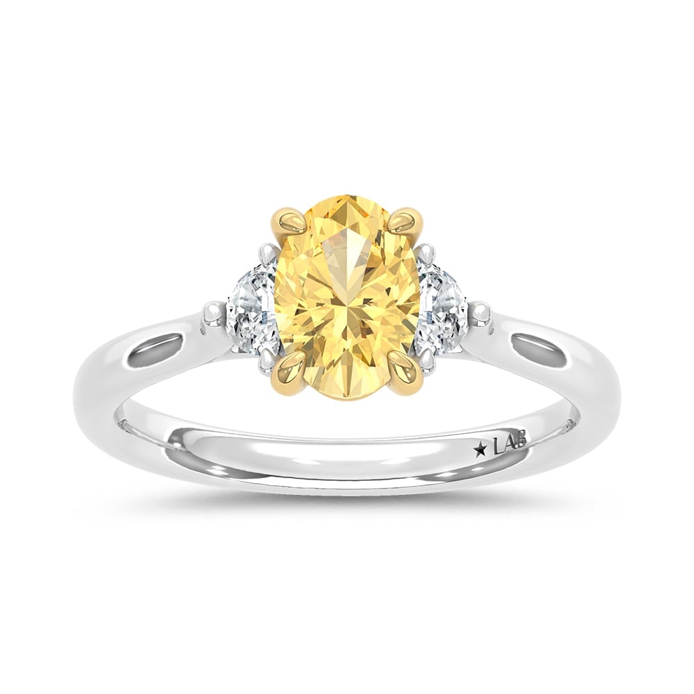 14K Two Tone Gold Lab Grown Diamond 1 1/6 Ct.Tw. Yellow Oval Engagement Ring (Center 1ct): 14K Two Tone Gold Lab Grown Diamond 1 1/6 Ct.Tw. Yellow Oval Engagement Ring (Center 1ct) Exude elegance with this 14K Two-Tone Gold Engagement Ring, featuring a captivating 1-carat lab-grown yellow d