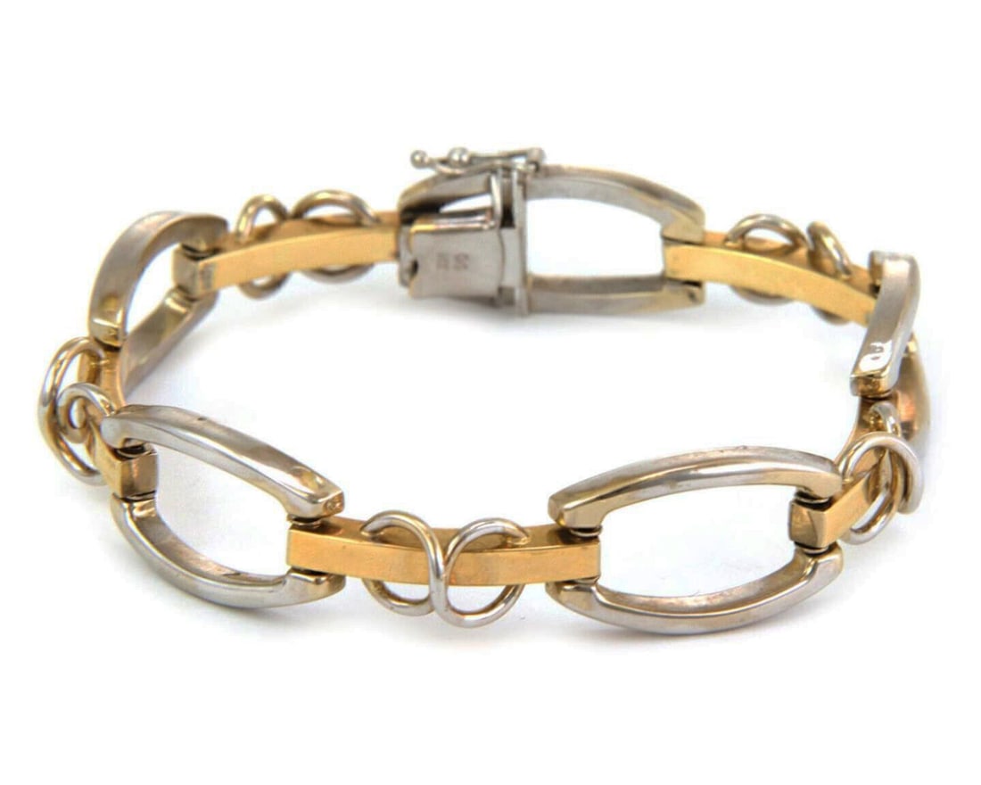 14k Yellow and White Gold Chain Bracelet with Open Link Design: 14k Yellow and White Gold Chain Bracelet with Open Link Design This vintage bracelet showcases an open design crafted from high-quality 14k two-tone gold, combining yellow and white gold links in a st