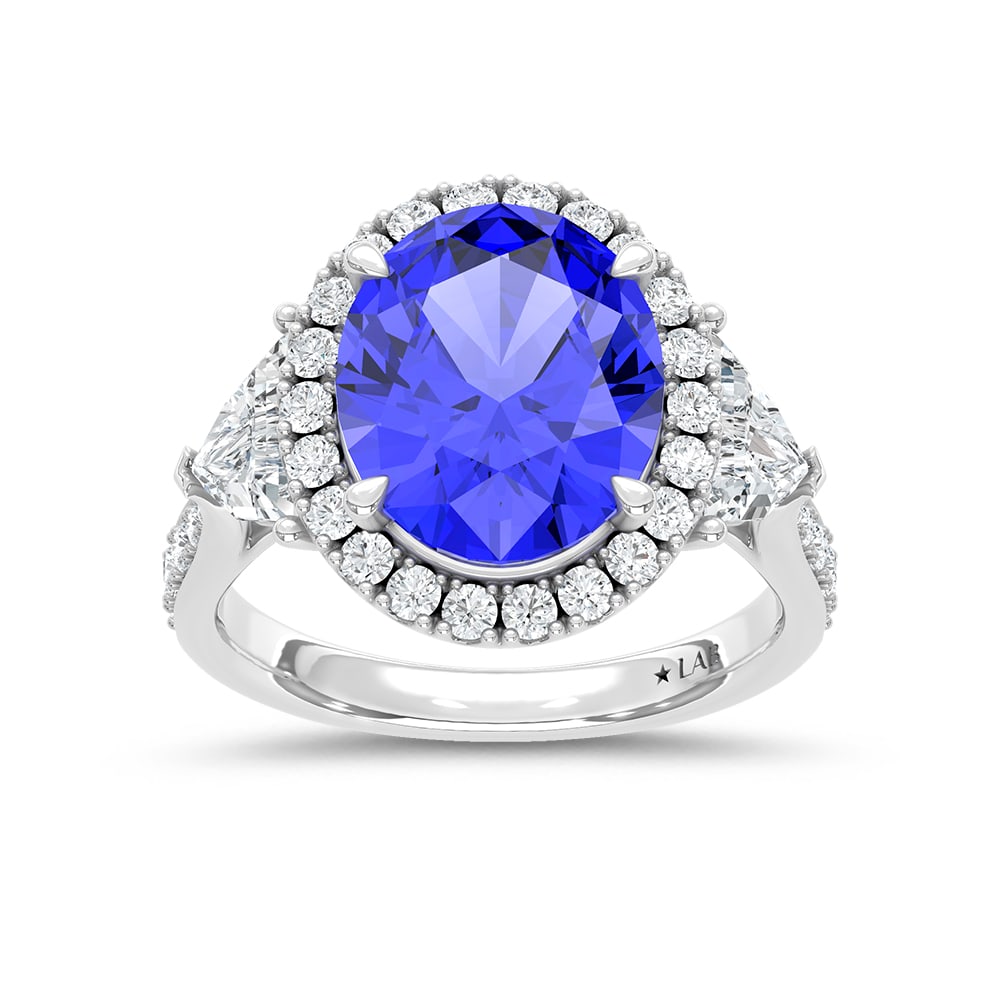 14K White Gold Lab Grown Diamond 8 1/2 Ct.Tw. Oval Shape Recrystalized Blue Sapphire Engagement Ring: 14K White Gold Lab Grown Diamond 8 1/2 Ct.Tw. Oval Shape Recrystalized Blue Sapphire Engagement Ring (Center 6 5/8 ct) Exude sophistication with this 14K white gold engagement ring. Its centerpiece is