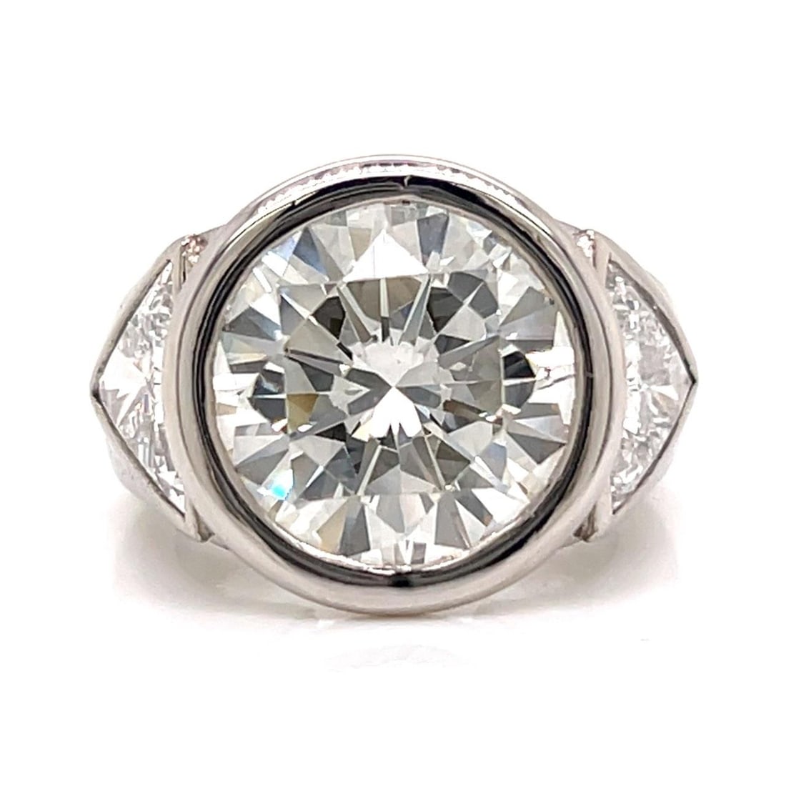 6.37 Carat Diamond Platinum Ring Featuring Boodles Design: 6.37 Carat Diamond Platinum Ring Featuring Boodles Design This platinum ring features a 6.37 carat center diamond with I-J color and VVS clarity. It is accented by two trillion-cut diamonds totaling a