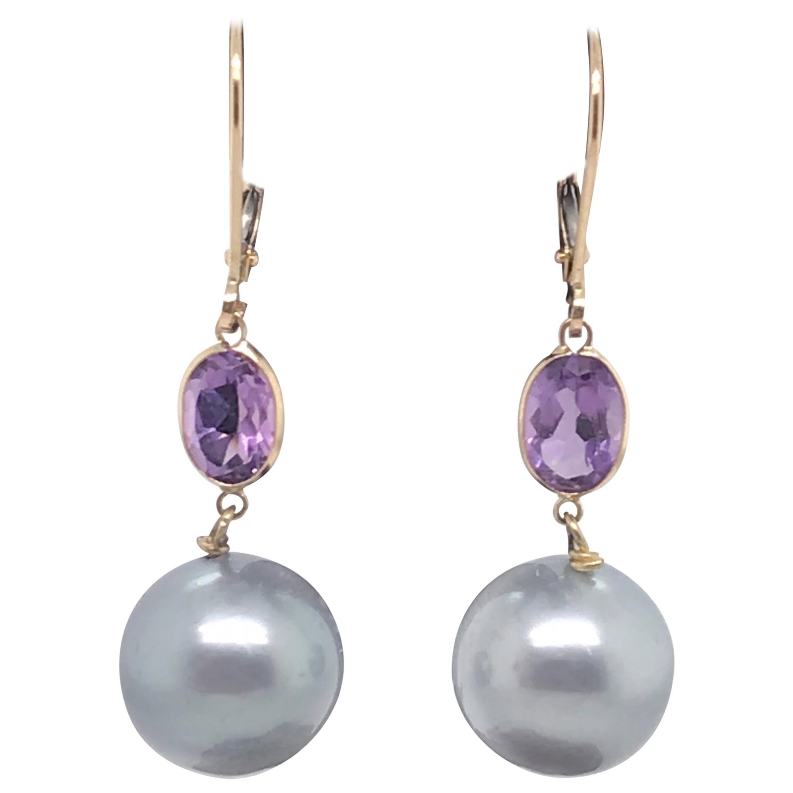 Harbor Diamonds 14K Yellow Gold Amethyst Tahitian Pearl Drop Earrings: Harbor Diamonds 14K Yellow Gold Amethyst Tahitian Pearl Drop Earrings Elevate your style with these stunning drop earrings, crafted from 14K yellow gold. Each earring features two exquisite oval-cut a
