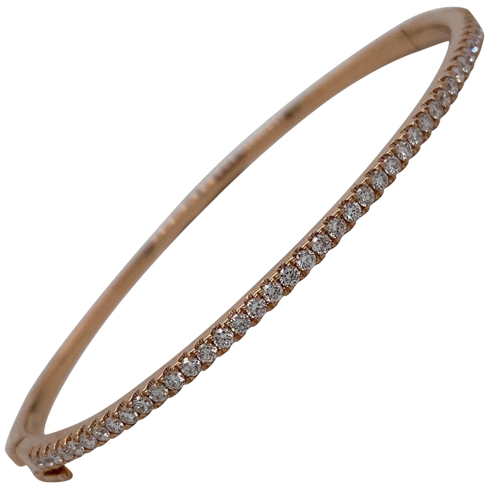 Harbor Diamonds 0.85ct Round Cut Diamond Bangle in 18K Rose Gold: Harbor Diamonds 0.85ct Round Cut Diamond Bangle in 18K Rose Gold This exquisite bangle bracelet is crafted from 18K rose gold and features 45 round brilliant diamonds, totaling 0.85 carats. The contem