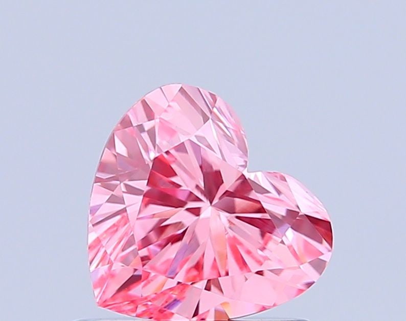Loose Diamond - HEART 0.77ct Fancy Vivid Pink VVS2: Loose Diamond - HEART 0.77ct Fancy Vivid Pink VVS2 Source: This is a real non-mined Diamond that has been grown in a lab Shape: HEART Carats: 0.77 Color: Fancy Vivid Pink Certification: IGI Video: