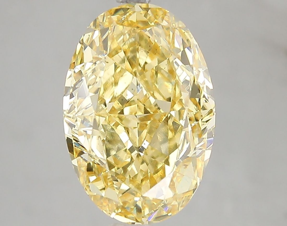 Loose Diamond - OVAL 5.12ct Fancy Vivid Yellow VS2: Loose Diamond - OVAL 5.12ct Fancy Vivid Yellow VS2 Source: This is a real non-mined Diamond that has been grown in a lab Shape: OVAL Carats: 5.12 Color: Fancy Vivid Yellow Certification: IGI Video: