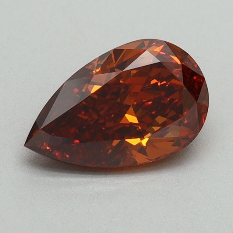 Loose Diamond - PEAR 0.96ct Fancy Orange VS1: Loose Diamond - PEAR 0.96ct Fancy Orange VS1 Source: This is a real non-mined Diamond that has been grown in a lab Shape: PEAR Carats: 0.96 Color: Fancy Orange Certification: IGI Video:
