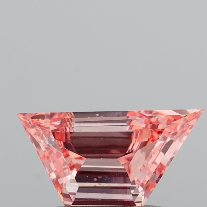 Loose Diamond - TRAPEZOID 0.59ct Fancy Intense Pink VS2: Loose Diamond - TRAPEZOID 0.59ct Fancy Intense Pink VS2 Source: This is a real non-mined Diamond that has been grown in a lab Shape: TRAPEZOID Carats: 0.59 Color: Fancy Intense Pink Certification: IGI