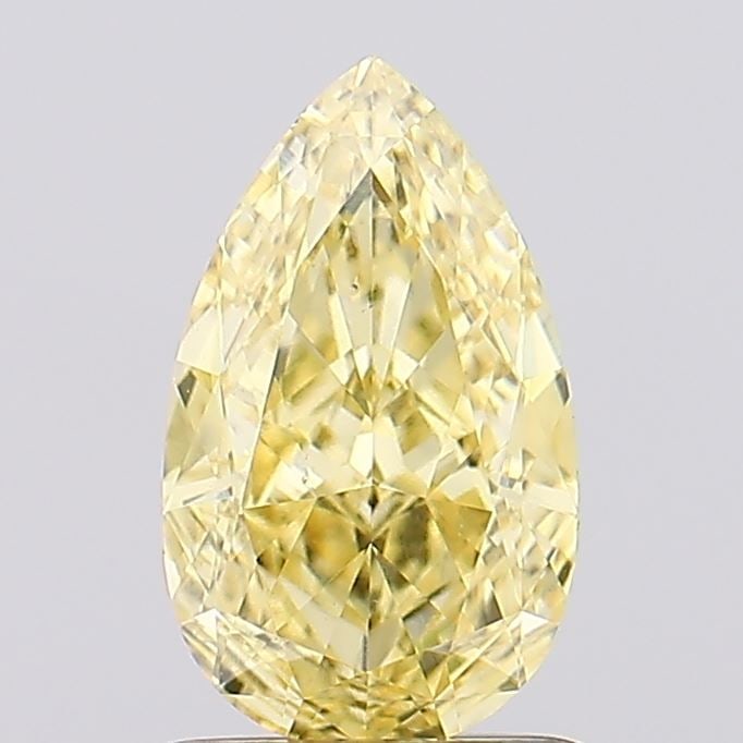 Loose Diamond - PEAR 1.29ct Fancy Vivid Yellow VS2: Loose Diamond - PEAR 1.29ct Fancy Vivid Yellow VS2 Source: This is a real non-mined Diamond that has been grown in a lab Shape: PEAR Carats: 1.29 Color: Fancy Vivid Yellow Certification: IGI Video: