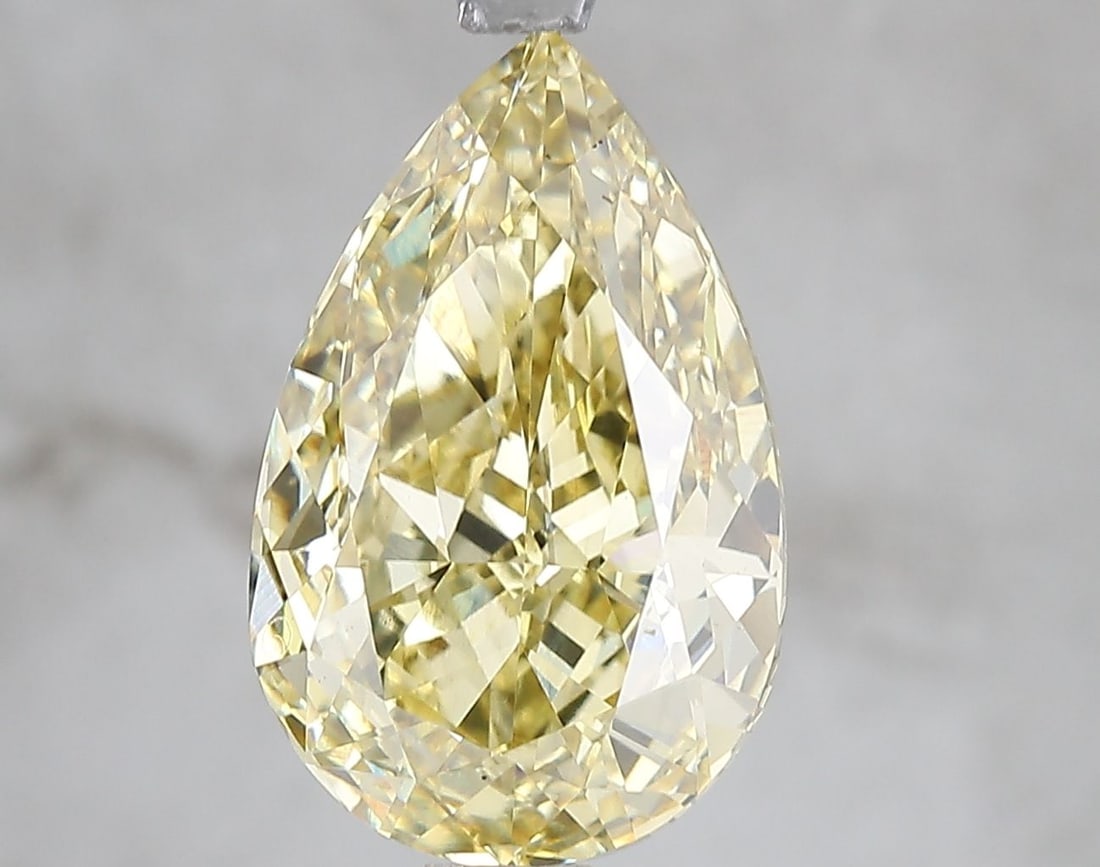 Loose Diamond - PEAR 5.03ct Fancy Vivid Yellow VS2: Loose Diamond - PEAR 5.03ct Fancy Vivid Yellow VS2 Source: This is a real non-mined Diamond that has been grown in a lab Shape: PEAR Carats: 5.03 Color: Fancy Vivid Yellow Certification: IGI Video: