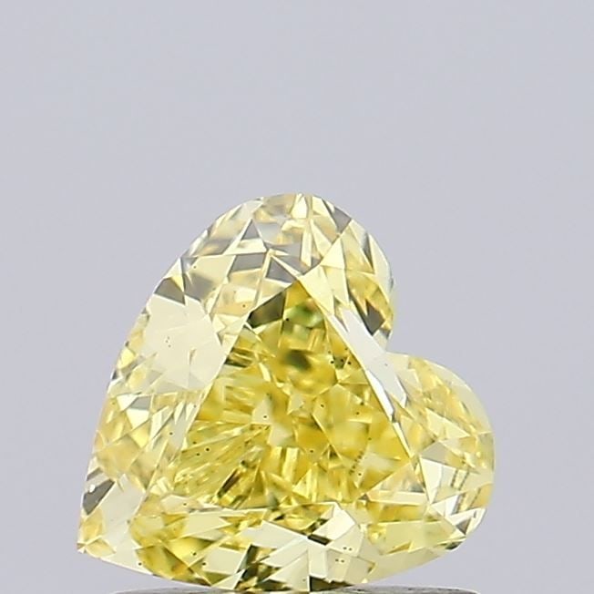 Loose Diamond - HEART 1.13ct Fancy Vivid Yellow VS2: Loose Diamond - HEART 1.13ct Fancy Vivid Yellow VS2 Source: This is a real non-mined Diamond that has been grown in a lab Shape: HEART Carats: 1.13 Color: Fancy Vivid Yellow Certification: IGI Video: