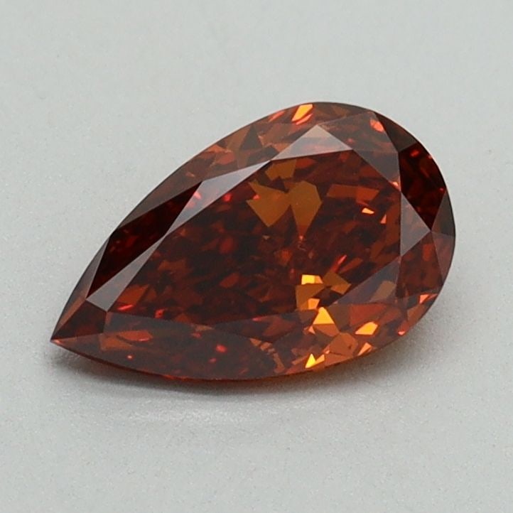 Loose Diamond - PEAR 0.79ct Fancy Orange VS2: Loose Diamond - PEAR 0.79ct Fancy Orange VS2 Source: This is a real non-mined Diamond that has been grown in a lab Shape: PEAR Carats: 0.79 Color: Fancy Orange Certification: IGI Video: