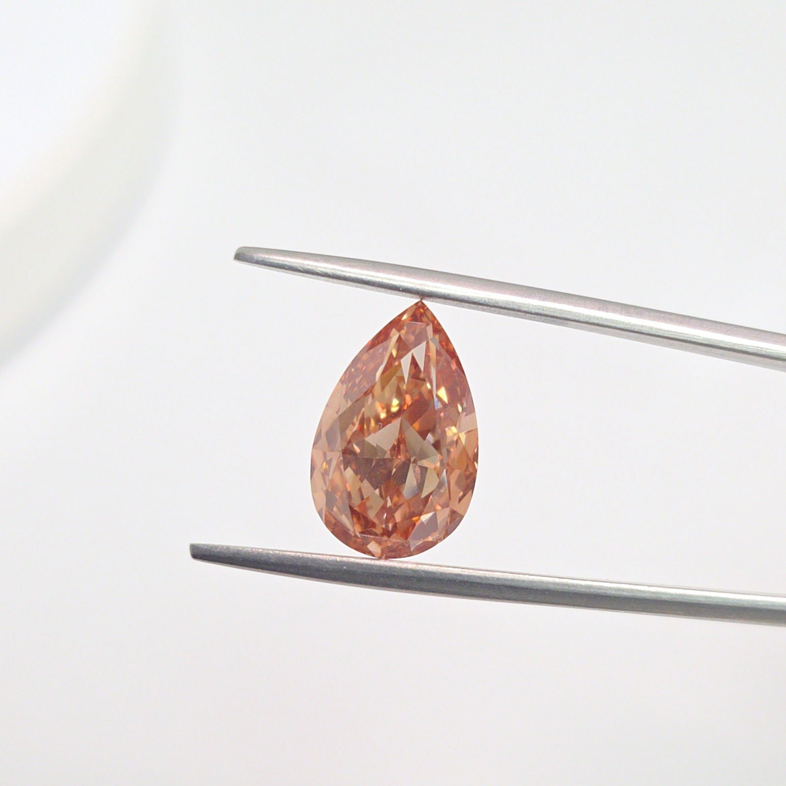 Loose Diamond - PEAR 5.27ct Fancy Orangey Brown VVS2: Loose Diamond - PEAR 5.27ct Fancy Orangey Brown VVS2 Source: This is a real non-mined Diamond that has been grown in a lab Shape: PEAR Carats: 5.27 Color: Fancy Orangey Brown Certification: IGI Video: