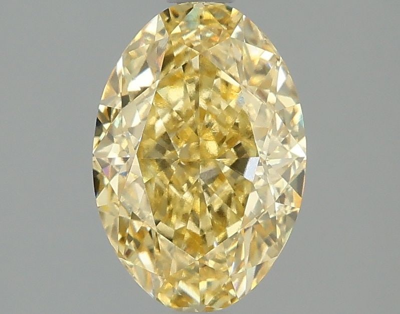 Loose Diamond - OVAL 1.98ct Fancy Vivid Yellow VS1: Loose Diamond - OVAL 1.98ct Fancy Vivid Yellow VS1 Source: This is a real non-mined Diamond that has been grown in a lab Shape: OVAL Carats: 1.98 Color: Fancy Vivid Yellow Certification: IGI Video: