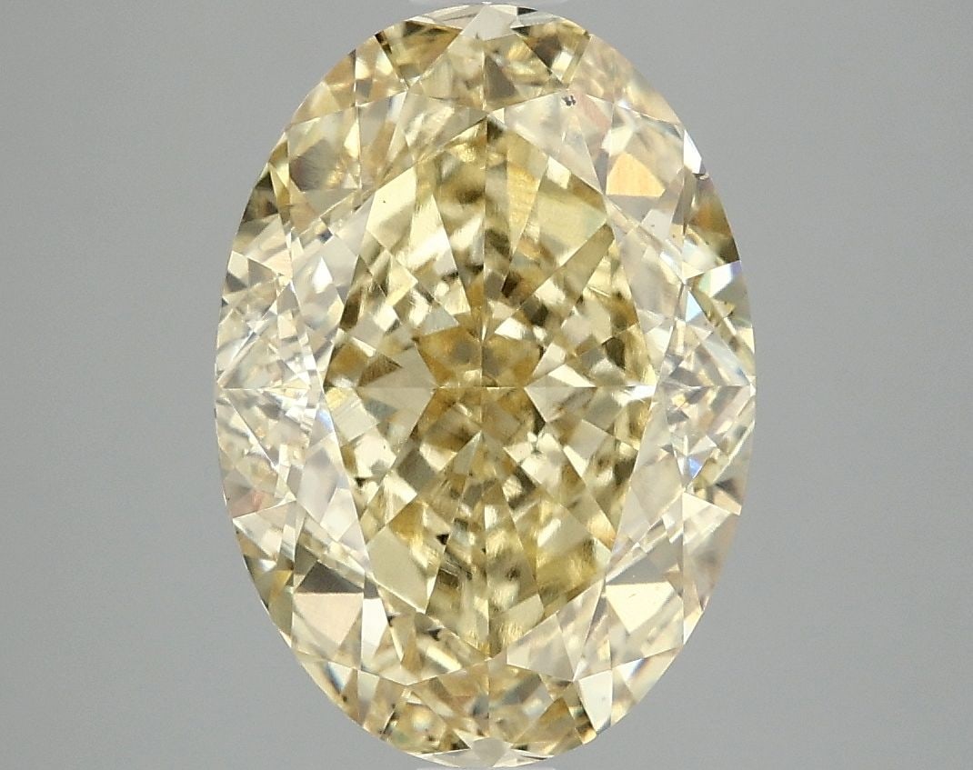 Loose Diamond - OVAL 5.09ct Fancy Vivid Yellow VS2: Loose Diamond - OVAL 5.09ct Fancy Vivid Yellow VS2 Source: This is a real non-mined Diamond that has been grown in a lab Shape: OVAL Carats: 5.09 Color: Fancy Vivid Yellow Certification: IGI Video:
