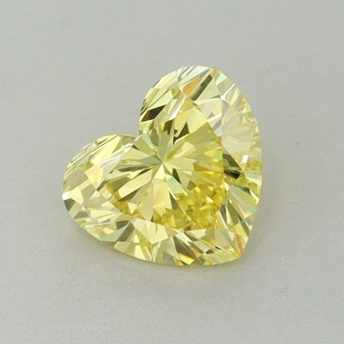 Loose Diamond - HEART 0.66ct Fancy Vivid Yellow VS1: Loose Diamond - HEART 0.66ct Fancy Vivid Yellow VS1 Source: This is a real non-mined Diamond that has been grown in a lab Shape: HEART Carats: 0.66 Color: Fancy Vivid Yellow Certification: IGI Video:
