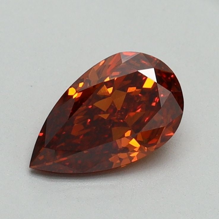 Loose Diamond - PEAR 0.72ct Fancy Vivid Orange VVS2: Loose Diamond - PEAR 0.72ct Fancy Vivid Orange VVS2 Source: This is a real non-mined Diamond that has been grown in a lab Shape: PEAR Carats: 0.72 Color: Fancy Vivid Orange Certification: IGI Video: