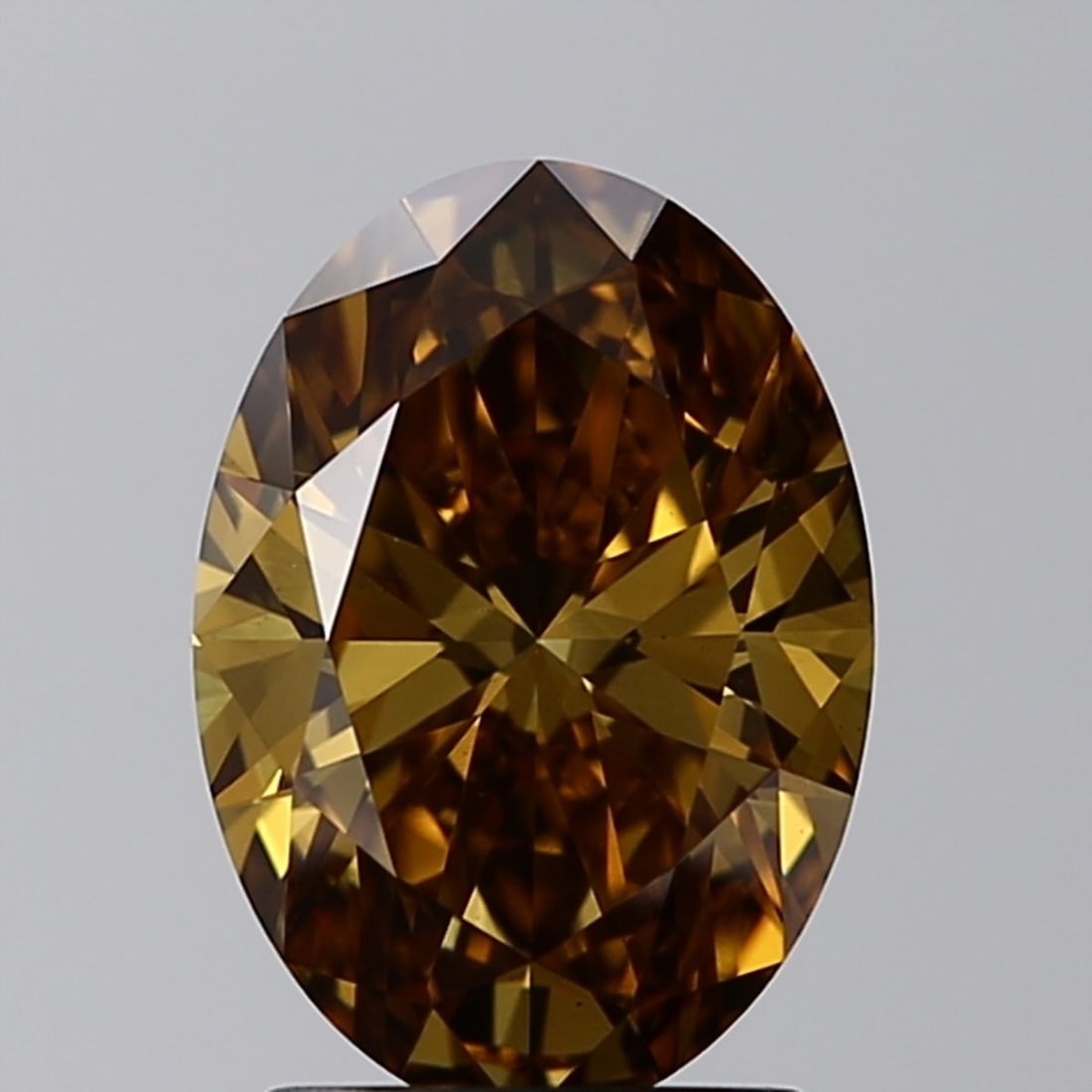 Loose Diamond - OVAL 2.0ct Fancy Vivid Brownish Yellow VVS2: Loose Diamond - OVAL 2.0ct Fancy Vivid Brownish Yellow VVS2 Source: This is a real non-mined Diamond that has been grown in a lab Shape: OVAL Carats: 2.0 Color: Fancy Vivid Brownish Yellow Certificati