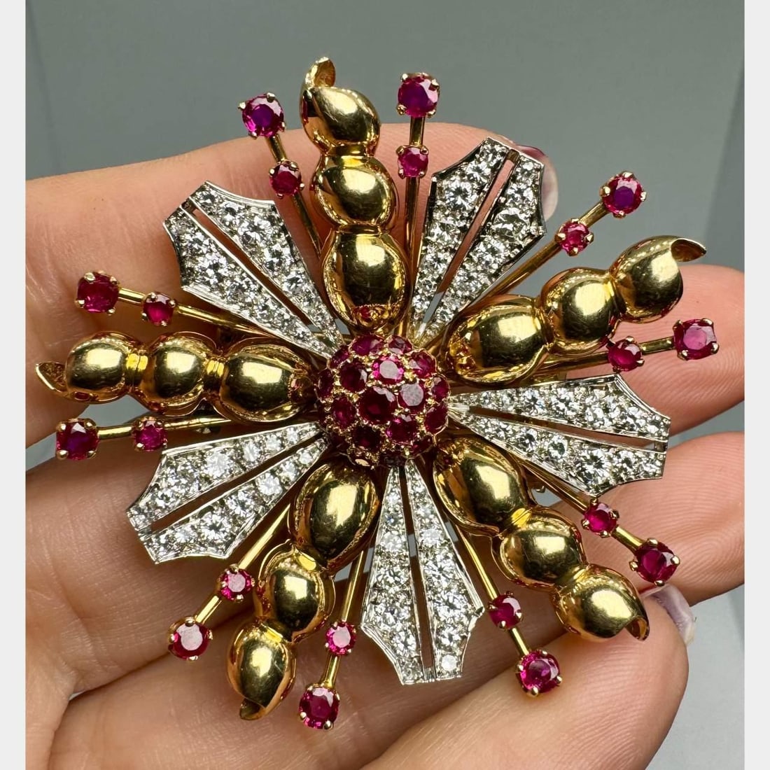 Retro 14K Yellow Gold Brooch with Burma Rubies and Diamonds: Retro 14K Yellow Gold Brooch with Burma Rubies and Diamonds This exquisite Retro brooch features a stunning combination of 14K yellow gold, Burma rubies, and European-cut diamonds. Weighing 31.5 grams